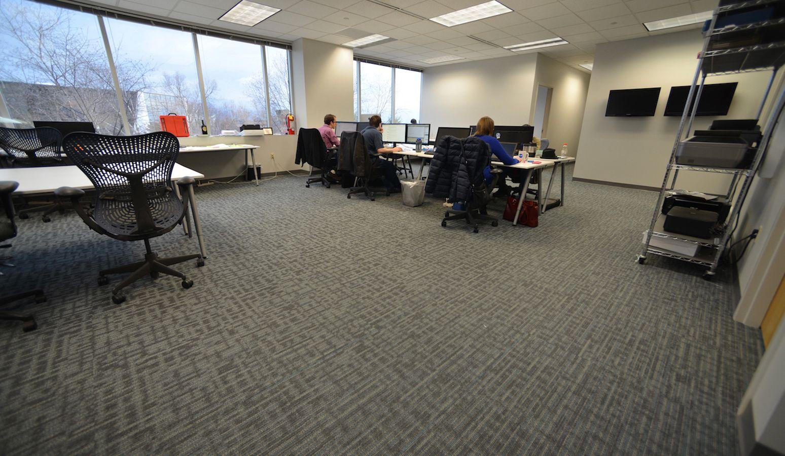 an image of people at their desk