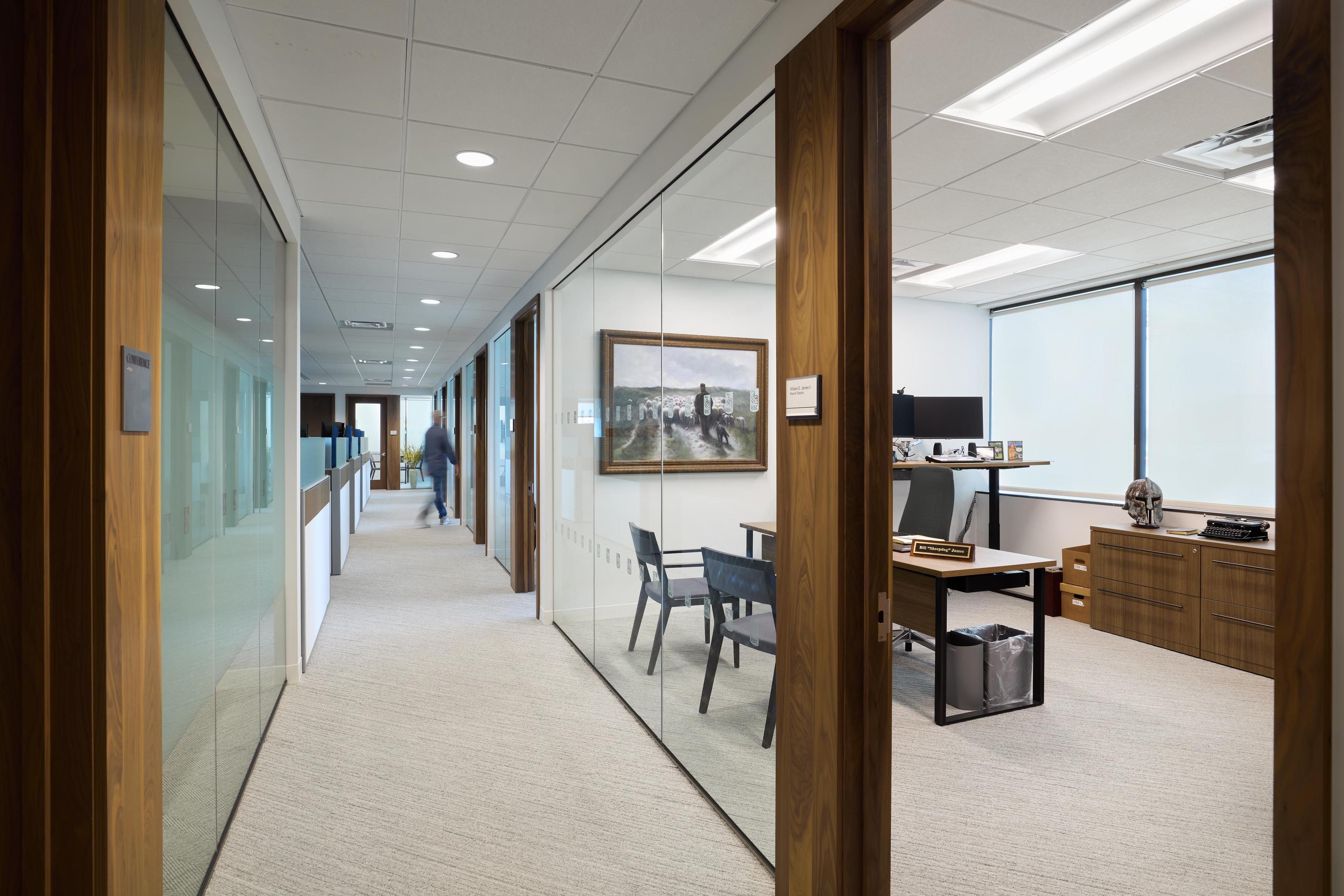 long hallway with glass offices on either side